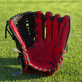 All black with red accent closed back semi-custom baseball glove. The Phantom, set on a turf baseball field